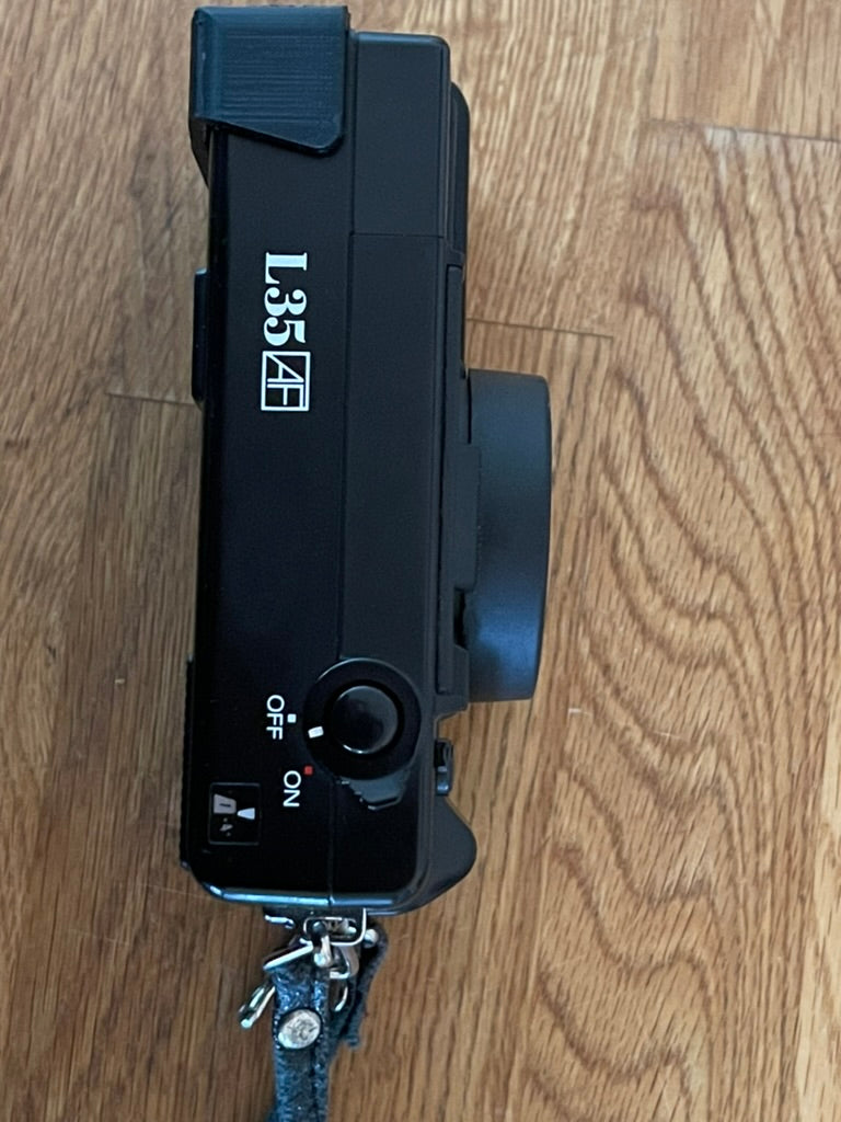 Nikon L35AF battery flap door fix