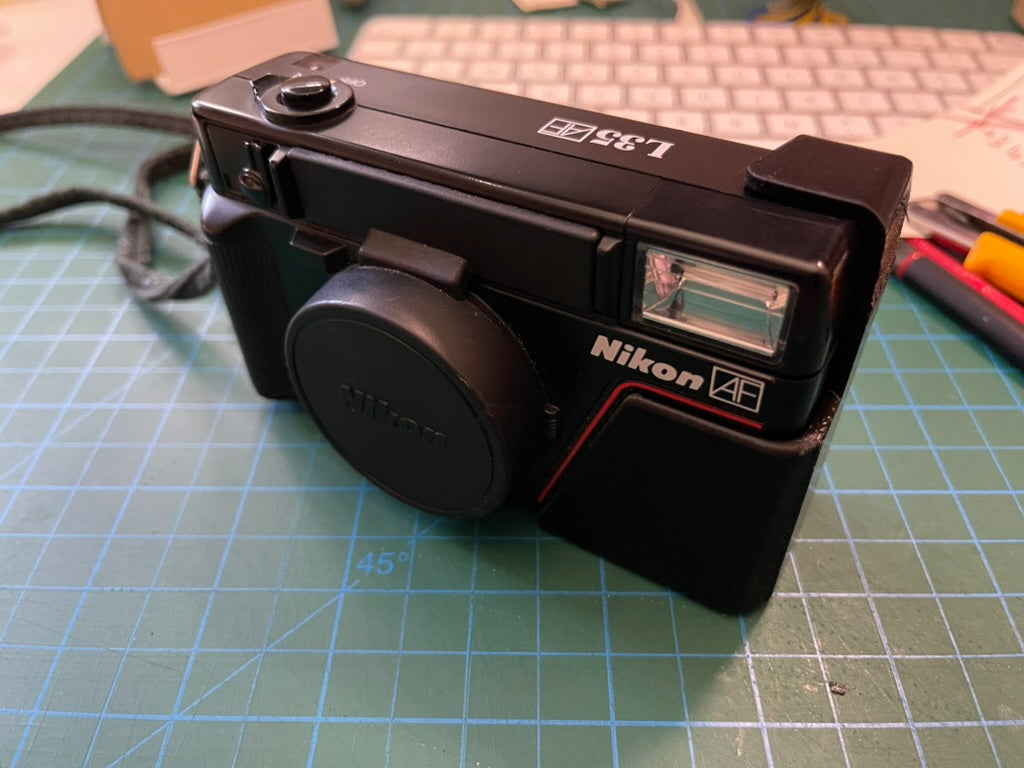 Nikon L35AF battery flap door fix