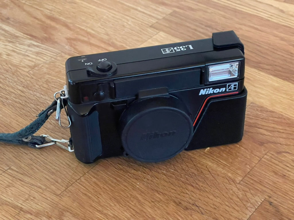Nikon L35AF battery flap door fix